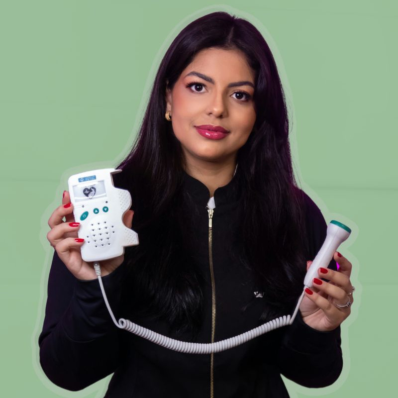 a young lady holding a medical equipment in her hands